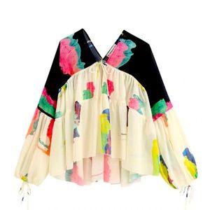 Sheer, Flowy Blouse that ties in the front.